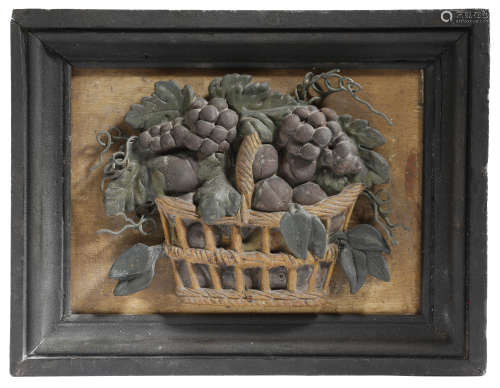 A 19TH CENTURY PAINTED PLASTER RELIEF OF A BASKET OF FRUIT c.1840 in an ebonised moulded frame 26