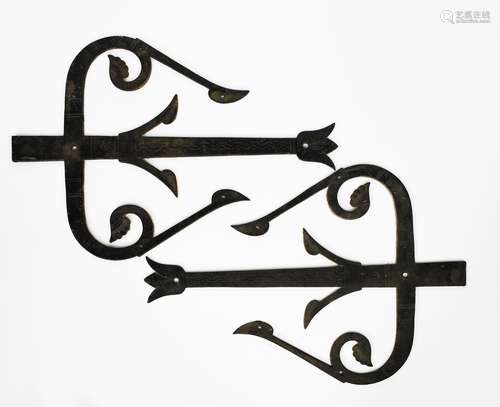 A pair of massive Aesthetic Movement wrought-iron hinges in the manner of Dr Christopher Dresser,