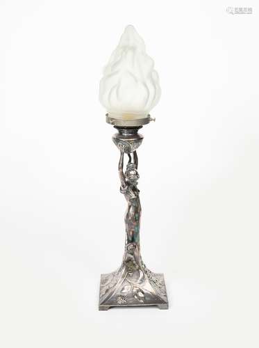 An Art Nouveau electroplated metal figural table lamp probably WMF, cast as a maiden holding up a