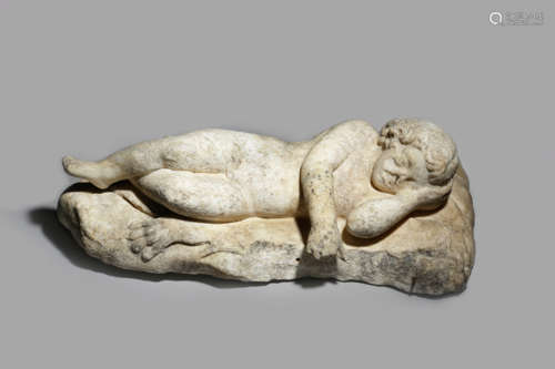 A CARVED MARBLE FIGURE OF EROS SLEEPING lying on the infant Hercules's lion's pelt spread over a