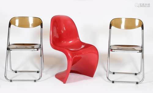 A Herman Miller red plastic Panton chair designed by Verner Panton, a pair of chrome metal and