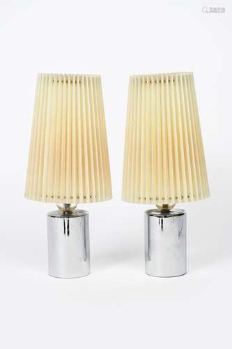 A pair of Adnet style chrome and glass table lamps, the cylindrical chrome base surmounted with a