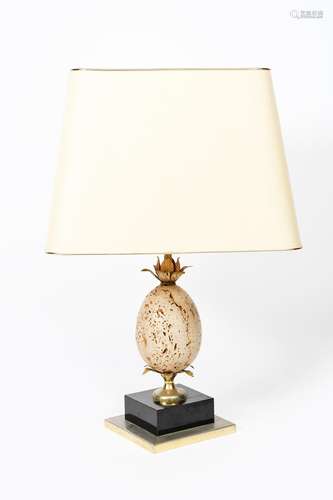 A Maison Charles style table lamp, stepped chrome and back square base supporting brass foliate