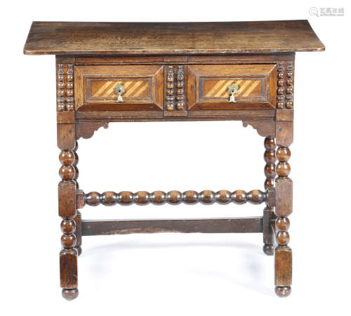 AN OAK SIDE TABLE LATE 17TH CENTURY AND LATER the single piece top above a frieze drawer with