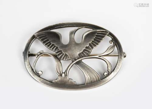 A Georg Jensen silver brooch designed by Arno Malinowski, model no.238, oval cast with a bird of