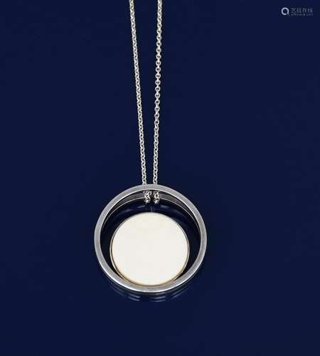 An Ib Bluitgen silver and ivory pendant necklace, model no.11A, two joined silver discs, set with