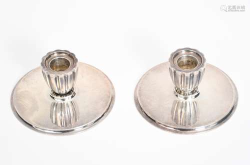 A pair of Georg Jensen silver candlesticks designed by Harald Nielsen, model no.897, shallow