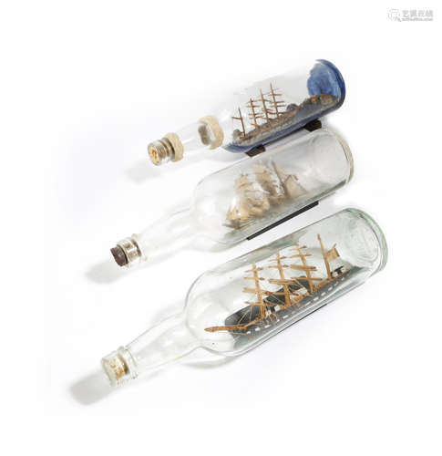 THREE SHIPS IN A BOTTLE EARLY 20TH CENTURY AND LATER depicting sailing ships, one in full sail,