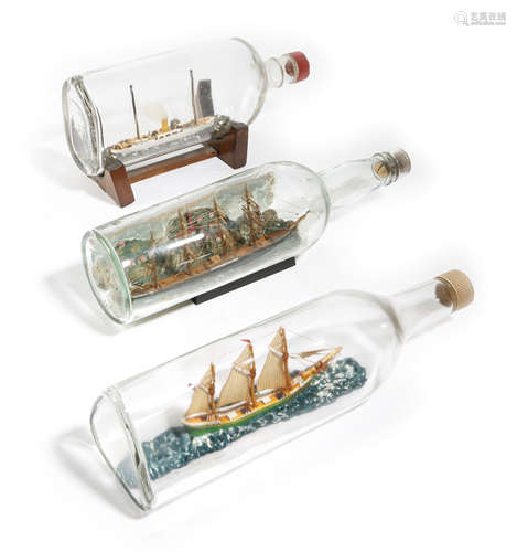 THREE SHIPS IN A BOTTLE EARLY 20TH CENTURY AND LATER one depicting a four-masted sailing ship before