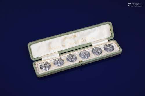 A set of six Keswick School of Industrial Arts silver buttons in original silk lined case, each