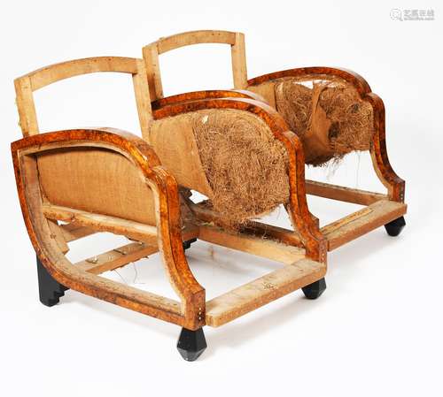 λ A pair of burr walnut veneer armchairs, on ebonised wood ball feet, inlaid with simple ivory disc