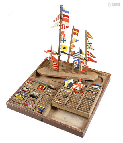 MARITIME INTEREST. A BOXED SET OF CARVED AND PAINTED WOOD NAVAL FLAGS 19TH CENTURY the stained