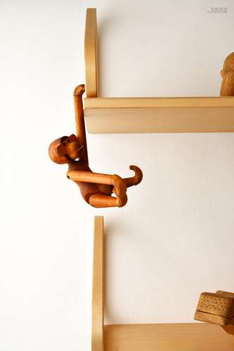 A teak and limba articulated monkey designed by Kaj Bojesen, designed 1951, and a collection of