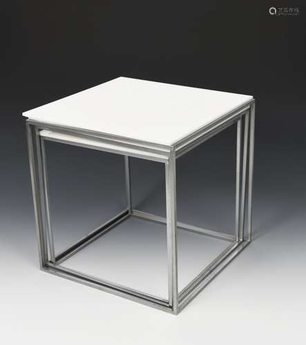 A nest of three Fritz Hansen PK71 occasional tables designed by Poul Kjaerholm, white acrylic top