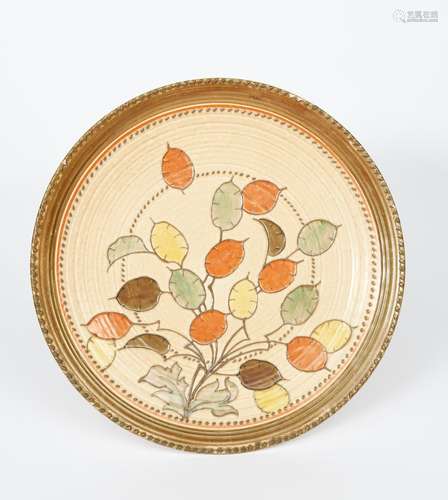 A rare Crown Ducal charger designed by Charlotte Rhead, tubeline decorated with honesty seed