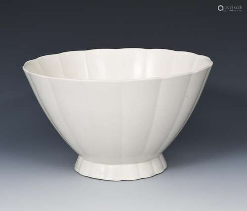 A Wedgwood Moonstone footed bowl designed by Keith Murray, footed, fluted form, covered in a matt