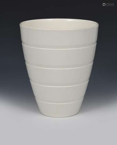 A Wedgwood Moonstone vase designed by Keith Murray, shape no.3842, flaring, ribbed bucket form,