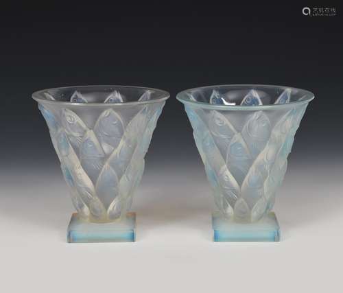 A pair of Sabino opalescent glass vases, flaring conical form on square feet, modelled in relief