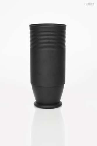 A rare Wedgwood Black Basalt vase designed by Keith Murray, shape no.3891, tall cylindrical footed