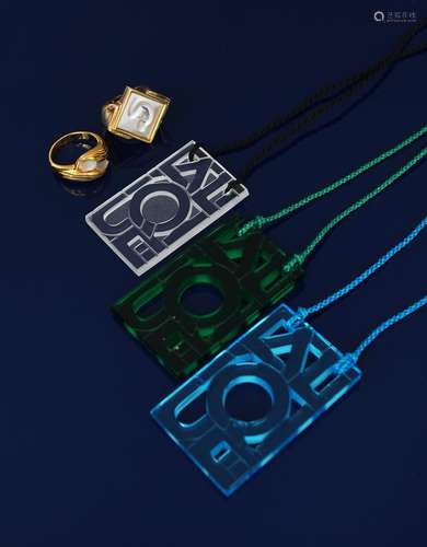 A Modern Lalique green glass pendant, rectangular pierced and cast with Lalique motif, on green