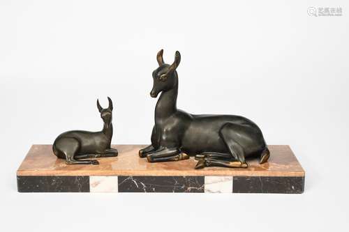 Irenee Rochard (1906-1984) Doe and Fawn a patinated spelter sculpture of two resting deer, on onyx