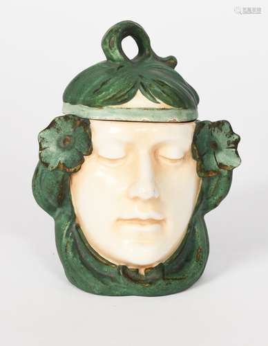 A Czechoslovakian pottery box and cover, modelled as an enigmatic maiden's head with headband and