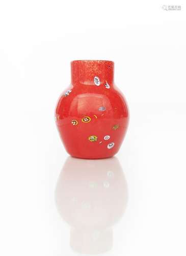 A rare Moncrieff's Monart Ware vase, milky off-white liner cased in red with millefiori cane