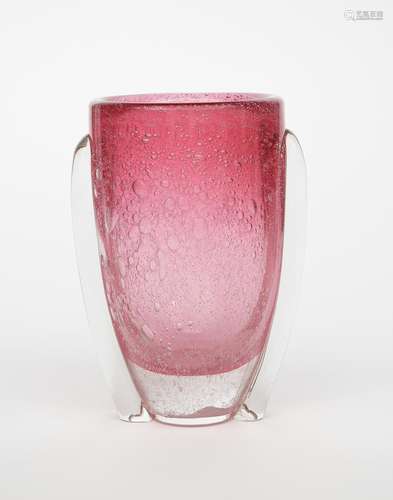 A glass vase in the manner of Daum, flaring cylindrical form, pale pink glass cased in clear with