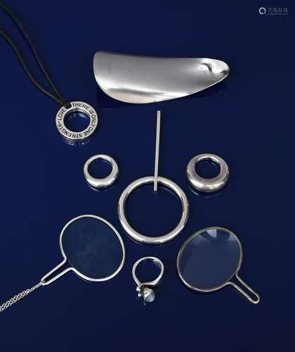 A Georg Jensen silver pendant, model no.141, simple ring with hooked bar stem, three Georg Jensen