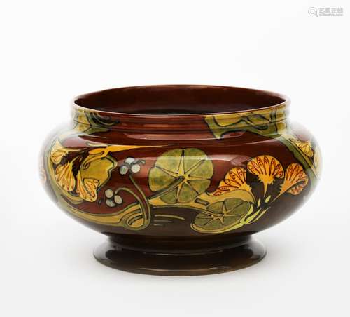 An Art Nouveau Rozenburg Den Haag pottery bowl, painted with a frieze of stylised flowers and