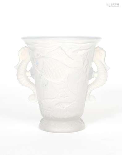 An opalescent glass vase probably Barolac, flaring, footed form cast in low relief with dish, with