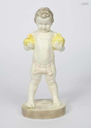 A Goldscheider Pottery model of a young boy by Brynski, model no.4287, modelled standing holding a