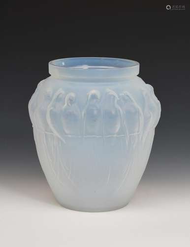 An Etling opalescent glass Bird of Paradise vase, moulded in low relief, cast Etling France to base,