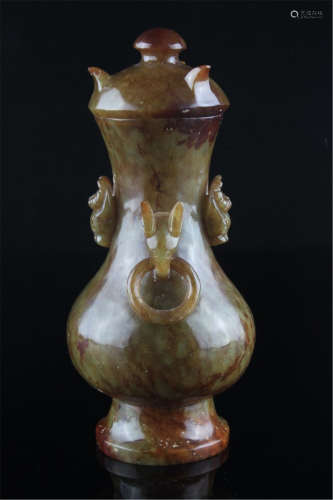 A Celadon and Russet Jade Vase