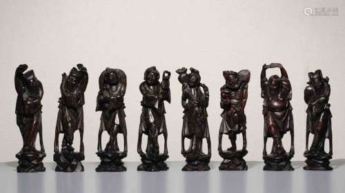 A Set of 8 Chinese Longan Wood Carved Immortals 