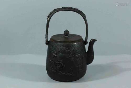 A Japanese Carved Iron Hoop-handled Kettle