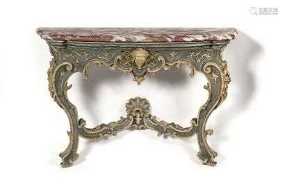Painted wooden console in an eventful shape, the Languedoc red marble top resting on curved winding uprights joined by a spacer surmounted by a stylized shell, the belt decorated with a mascaron in an entourage of trellises and staples.  South of France, early 18th century.  H : 86 cm, W : 126 cm, D : 41 cm