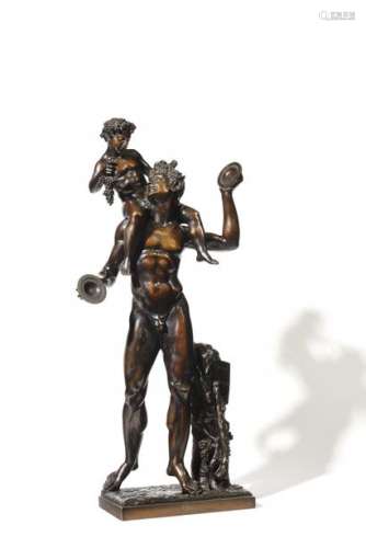 Bronze group with brown patina representing the young Bacchus on the shoulders of a satyr with cymbals in the taste of Antiquity.  19th century.  H : 77 cm