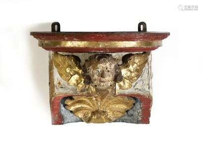Painted and gilded woodwork element forming a console, with bust and shell decoration. (accidents).  19th century.  H : 27 cm, W : 37 cm, D : 28 cm