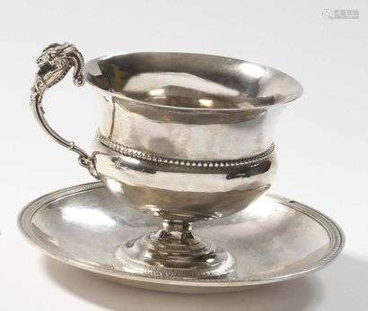 Cup and saucer in plain silver with pearl and water leaf mouldings. The handle underlined by a goat.  PARIS 1819- 1838 Goldsmith : Marc-Augustin LEBRUN Weight : 350 g (Shock and restoration on the pedestal of the cup)