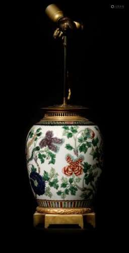 Ovoid-shaped Chinese porcelain vase with white background and polychrome decoration of flowering branches decorated with a chased bronze frame with a 19th century cut-sided base (mounted as a lamp) H: 29.5 cm