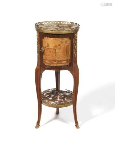 Circular table in architectural marquetry in amaranth frames, opening to a leaf and resting on arched legs joined by a spacer tablet (redone), gilt bronze scraps (brought back at a later date), Sarrancolin marble top with gallery. Louis XVI period (restorations). H : 76 cm, D : 31 cm