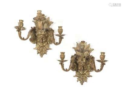 Pair of gilt bronze three-light sconces with satyr heads in a surround of foliage. Louis XIV style, 19th century. H : 38 cm, W : 40 cm
