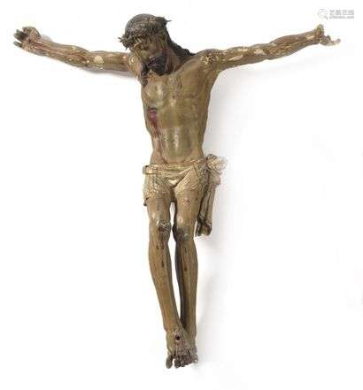 Carved and polychromed wood Christ. Head tilted on the right shoulder surrounded by a crown of thorns, hair falling to the nape of the neck and on the right shoulder, knotted perzonium with a fall on the left hip, feet superimposed in internal rotation. XVIIth century Height: 87 cm (small accidents and lacks)
