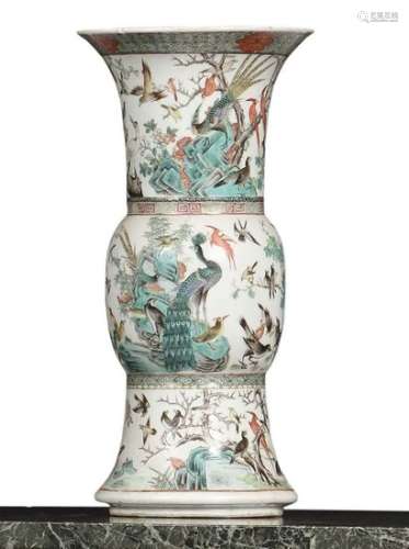 CHINA Porcelain vase of baluster shape decorated in enamels of the green family of landscapes with phoenix, peacocks, budgies, blackbirds, magpies. XIXth century Tall: 45 cm (a crack visible at the neck)