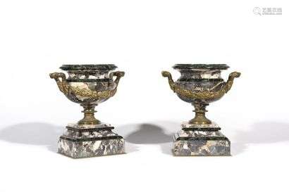 Pair of breccia marble cups molded with side handles and a chiseled frame of garlands of flowers. They rest on a round pedestal base and a rectangular stepped base in marble veneer Neoclassic style H : 25,5 , W : 16 , D : 12 cm