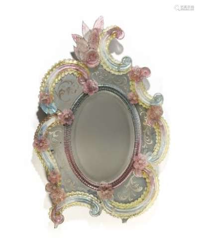 Asymmetrical Venetian glass mirror, decorated with blue and pink tinted flowers and staples, on an engraved mirror background. 18th century style. H : 72 cm, W : 48 cm