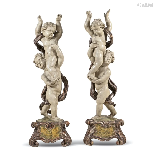 Pair of lacquered and gilt wood sculptures