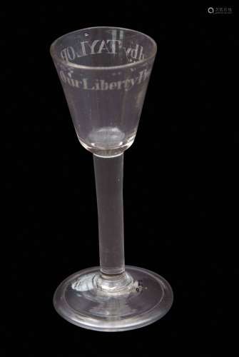 Mid-18th century important political wine glass, the rounded funnel bowl above a plain stem and