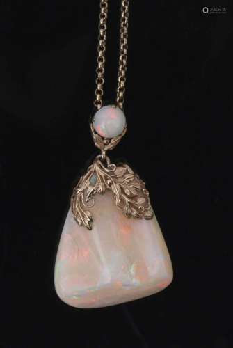 White crystal opal pendant of irregular triangular form, 40 x 35mm, decorated with a yellow metal